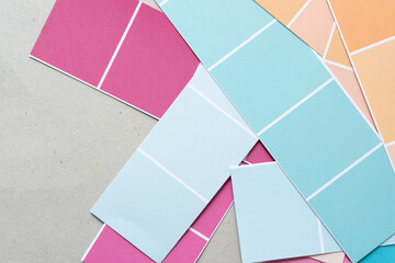 abstract background with scattered overlapping paper stripes and grid pattern in pink, blue, and orange