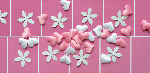 floral confetti and fabric hearts on pink