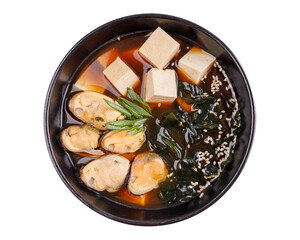 Miso soup with mussels, miso pasta, tofu, wakame seaweed, green cibula, white sesame seeds.for online restaurant menu on white background