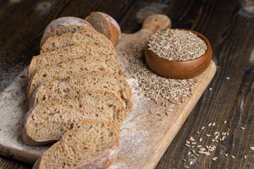 Cut into pieces fresh baked loaf of dark bread
