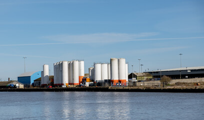 Industrial units on the side of the River Yare docks in the seaside town of Great Yarmouth on a sunny day