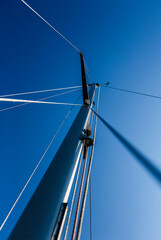Sailing boat beam pole with cables and blue sky background