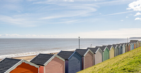 Colourful beach huts on the promenade or esplanade in the seaside town of Gorleston on the Norfolk...