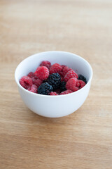 raspberry and blackberry in a white bowl