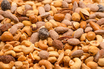 A group of almonds, pistachios, walnuts, macadamia, cashews.