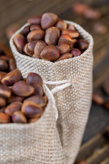a bunch of pine nuts in the shell