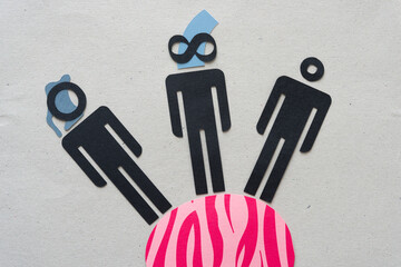 silhouette figures standing on striped paper object