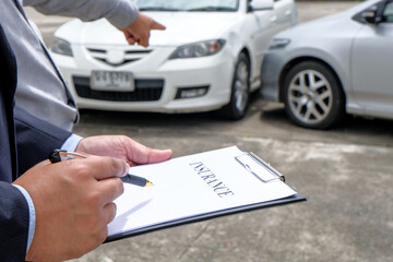Loss Adjuster Insurance Agent Inspecting Damaged Car. .Sales manager giving advice application form...