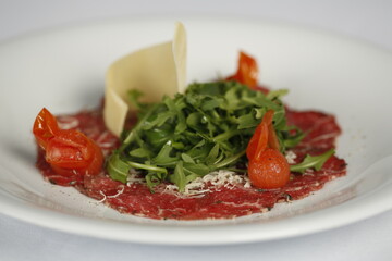 Raw meat salad and cheese dish