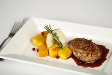 Tasty ducks breast with pumpkin and cranberry sauce