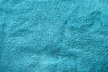 The fabric texture is made of blue microfiber. Close-up
