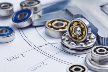 bearings of different types, micrometer, caliper and ruler on the drawings of technical products. Technologies and engineering.