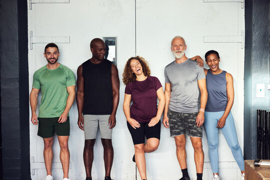 Friends laughing before a gym workout