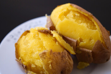 close-up of boiled whole potatoes in the plate,boiled large potatoes with the peel,