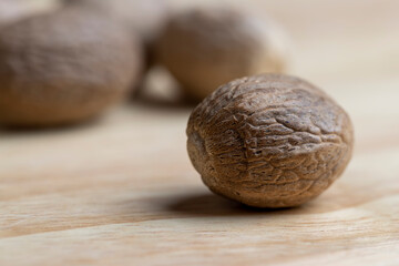 A whole nutmeg fruit on the kitchen table