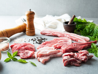 Various cuts of meat, spices and vegetables