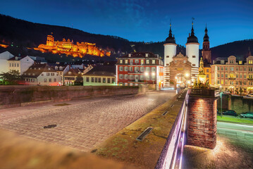 Old Bridge (Alte Brucke) at night with Bruckentor (Bridge Gate) and Heidelberg Castle - Heidelberg, Germany