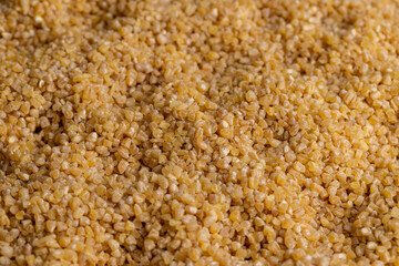 Fresh wheat porridge but cooked scattered on the table