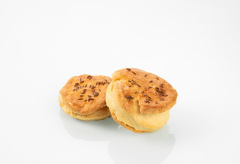National Hungarian cuisine.Two buns with caraway seeds on a white mirror background