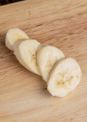 a ripe sweet banana cut into pieces lies on the table