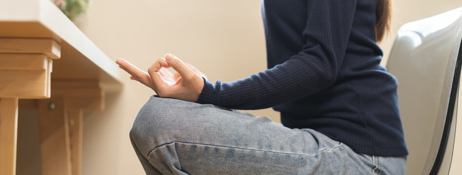 Hand of mental balance, asian young woman, girl practice sitting yoga in lotus position, meditating calm pose for meditation, exercise for wellbeing, healthy care. Relaxation, leisure people lifestyle