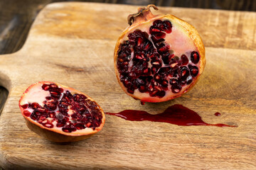 Half-cut ripe red pomegranate with mold