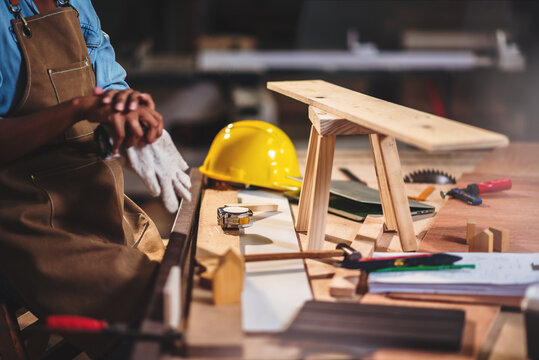 African american woman craftgirl working in handmade DIY workwood workshop, Small business owner in furniture industry.