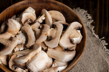 Peeled, washed and cut mushrooms champignons during cooking