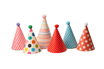 A group of bright and colorful birthday caps isolated on a white background.
