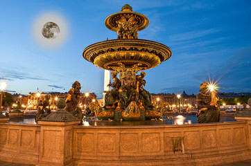 Fototapeta na wymiar Fountain at the Place de la Concorde in Paris by night (with the moon), France