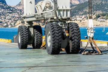 Giant wheels on a large-tonnage crane, in a port shipyard