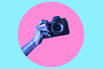 Modern Design. Modern art collage with an image of a man's hand holding a camera, taking a picture.