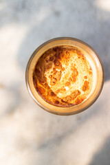 Dirty coffee on table in the garden with shade of sunlight. Good time with coffee.