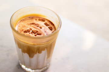 Dirty coffee on table in the garden with shade of sunlight. Good time with coffee.