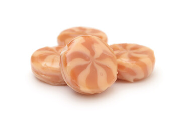 Cream candies isolated on white.