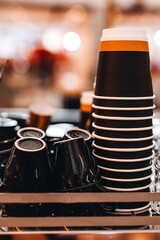 Black porcelain cups and paper coffee cups