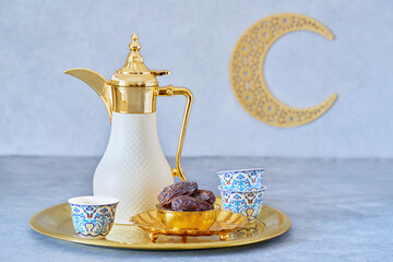 Arabic coffee and dates  . Dallah with crescent moon . Ramadan background