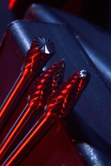 cutters of tungsten carbide on the background of metal blanks. Close-up.