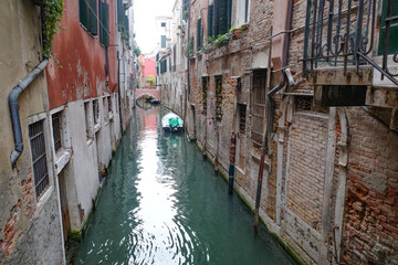Venice, Italy - 14 Nov, 2022: Colourful backstreet canals of the Venetian Lagoon