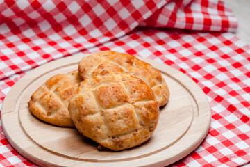 cracklings buns on wooden board