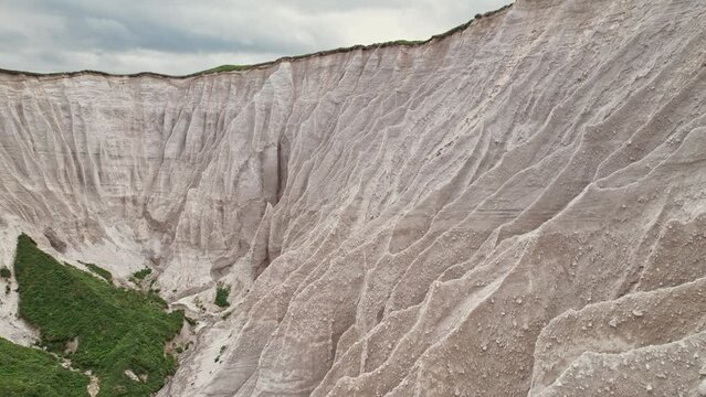Russia, Kuril Islands, Iturup Island, White rocks on the coast of the Sea of Okhotsk.