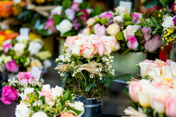 Beautiful rose bouquets sold on outdoor flower shop in Milan, Italy