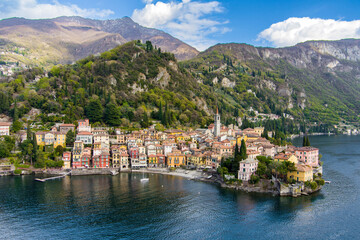 Fototapeta na wymiar Beautiful aerial waterfront cityscape of Varenna, one of the most picturesque towns on the shore of Lake Como. Charming location with typical Italian atmosphere. Varenna, Italy.