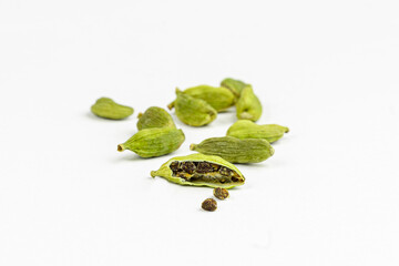 Cardamom pods and seeds isolated on white background