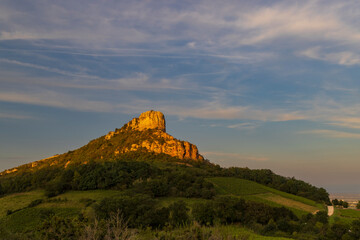 Fototapeta premium Rock of Solutre with vineyards, Burgundy, Solutre-Pouilly, France
