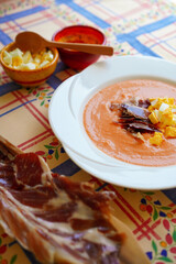 Salmorejo served with jamón and boiled egg, refreshing Spanish tomato cold soup from Cordoba, Andalusia, Spain