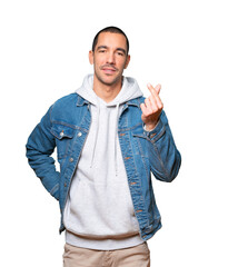 Young man making a gesture of worried about his economy