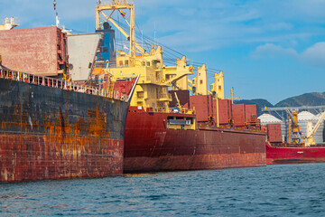 cargo ships in port - obrazy, fototapety, plakaty