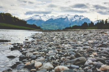 Pebbles and rocks on a mountain river bank