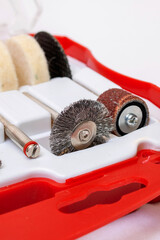 Set of nozzles for engraver in plastic box on white background